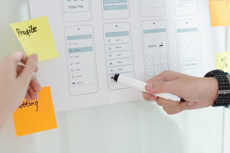 Designer discussing menu of mobile app