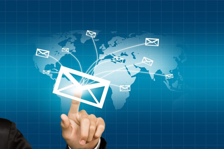 Hands with world mail delivery on world map background